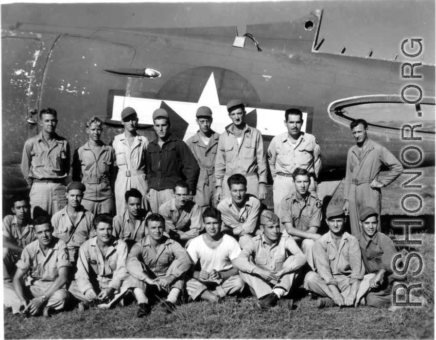 Some American aircraft mechanics and engineers of the 396th Air Service Squadron at Ankang, China, in China during WWII, posing as a group before the partial shell on a C-47 cargo plane that is being used for parts:  First row:  Davis, Clasby, Rush, Anderson, Lt.Chavez, Manuel, Villareal  Second row: Orona, Hoffman, Speer, Clemens, Weidenbener, Hawkins  Third row: Gerdsen, Knecht, Jones, Bowen, Galpen, Szapella, Prock, Mehlenbacher