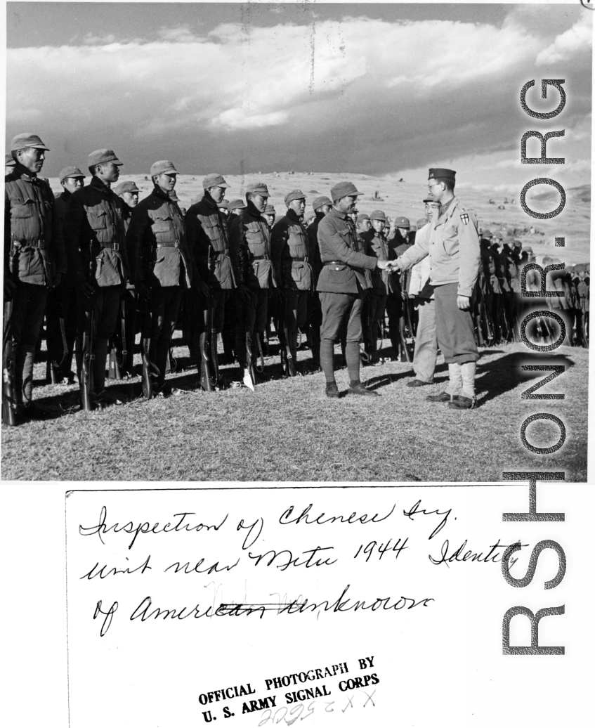 American officer, with his translator, inspecting Chinese unit and being welcomed warmly near Mitu, in 1944, in the CBI during WWII.  Official photo of U. S. Army Signal Corps