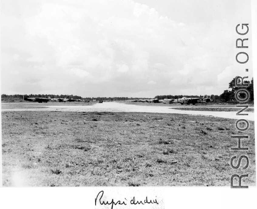 B-24 lined up at Rupsi airbase during WWII.