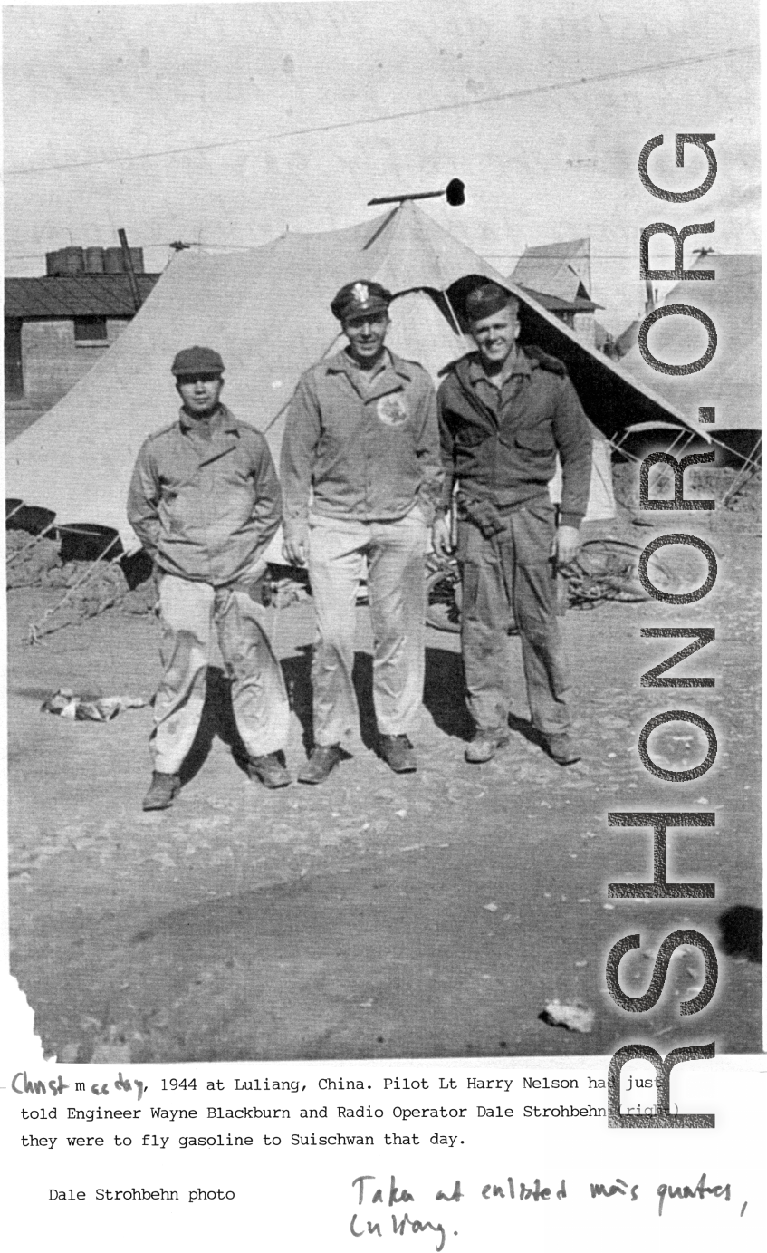 Christmas day, 1994, at Luliang, China. Pilot Lt. Harry Nelson had just told Engineer Wayne Blackburn and Radio Operator Dale Strohbehn (right) they were to fly gasoline to Suichuan (Suischwan) that day. Photo taken at Enlisted Men’s quarters, Luliang.  Photo from Dale Strohbehn.