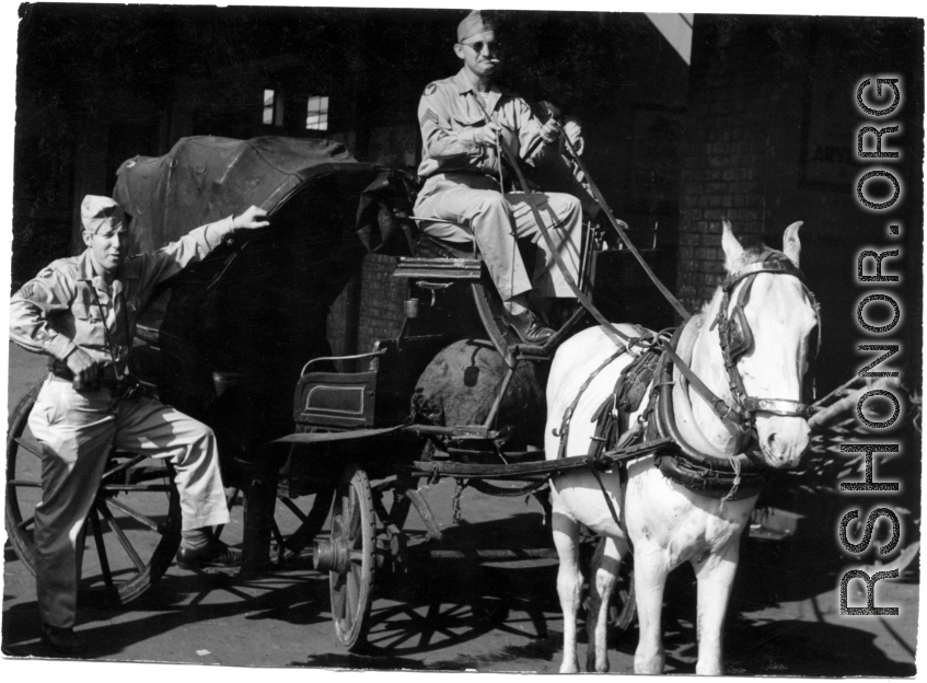 GIs play with horse-drawn carriage in India during WWII.