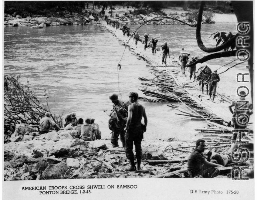 GIs cross Shweli River on bamboo pontoon bridge on January 2, 1945, in the CBI.