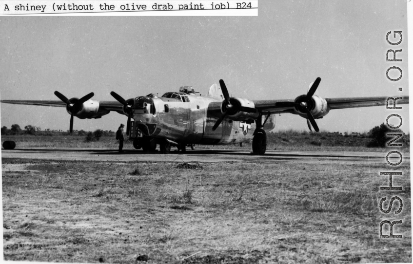 A B-24 bomber without the paint finish, in shiny aluminum, in the CBI during WWII.