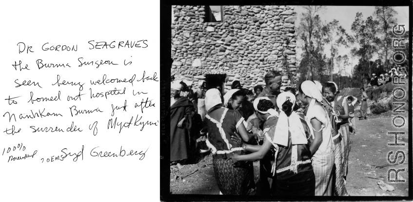 Dr. Gordon Seagrave receives joyful welcome at his bombed out hospital in Namhkan, Burma, after the surrender of Myitkyina.  Photo by Syd Greenberg.