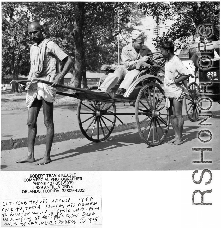 Sgt. Bob Travis Keagle shows his camera to a rickshaw walla in Calcutta, India, in 1944. 40th Photographic Reconnaissance Squadron.  Photo from Robert Travis Keagle.