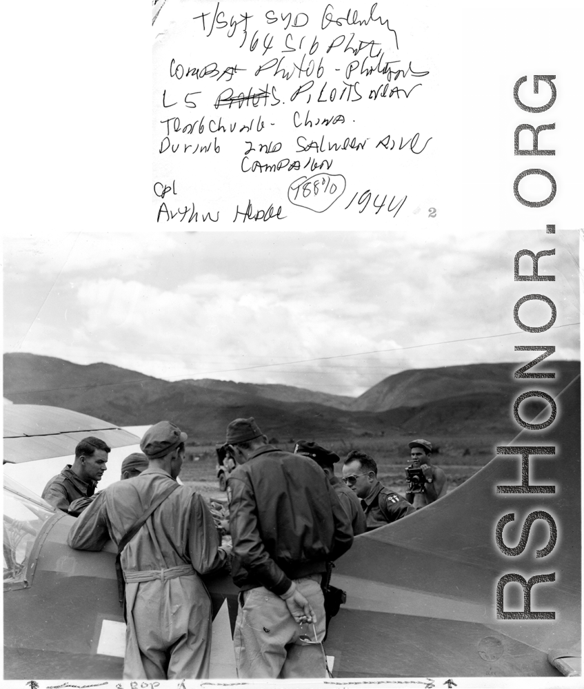 T/Sgt. Syd Greenberg. 164th Signal Photographic Company photographers. L-5 pilot P. Loris. Near Tengchong (Tengchung), China. During 2nd Salween River campaign, 1944. Cpl. Arthur Hedge