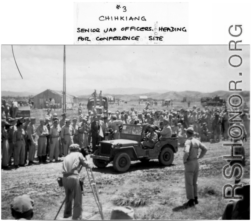 Senior Japanese officers heading for surrender conference site by jeep, during WWII.