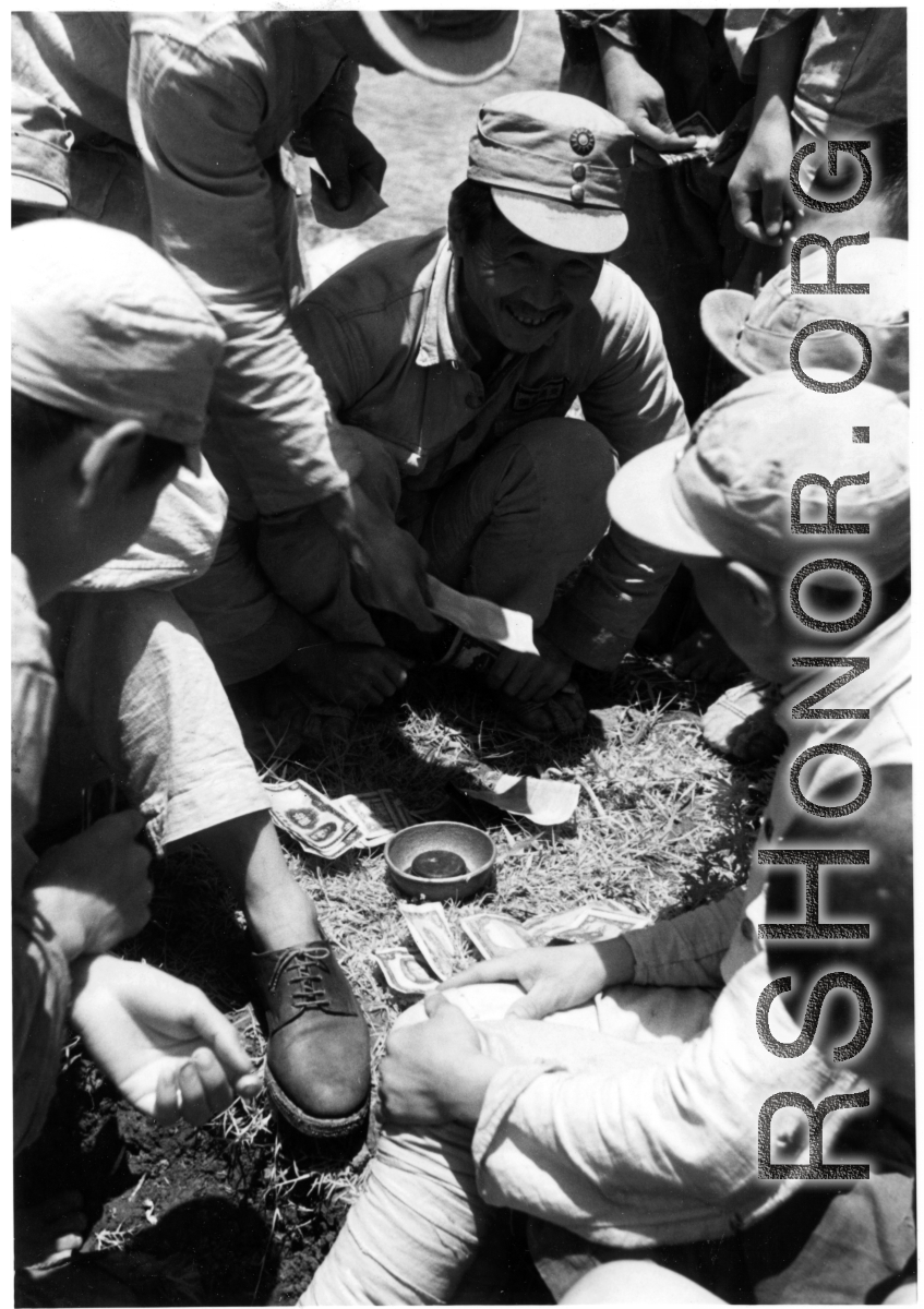 Chinese troops gambling. In the CBI during WWII.