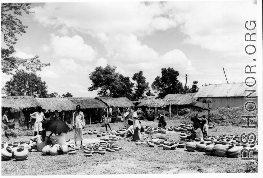 Earthenwares on display for sale at a market in Burma or India, during WWII.