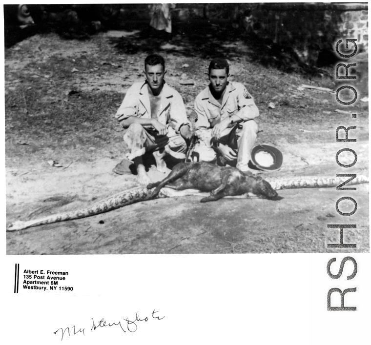 GIs pose with a snake that ate a large mamal.  Photo from Albert E. Freeman.