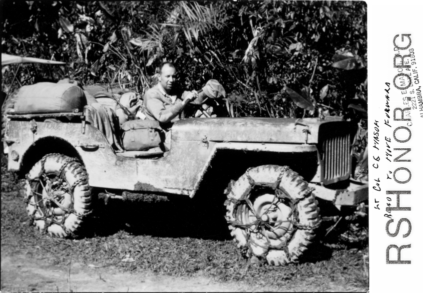 Lt. Col. Charles E. Mason on a muddy jeep, and ready to move forward, in the CBI during WWII.