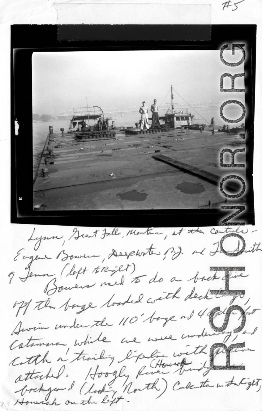 xxx"Lynn, Great Falls, Montana, at the controls. Eugene Bowers, Deepwater, New Jersey, and Lou Smith, of Tennessee (left to right).  Bowers used to do a back dive off the barge loaded with deck cargo, swim under the 110' barge and 40-plus foot catamaran, while we were underway, and catch a trailing lifeline with preserver attached.   Hooghly River (Howrah bridge in background, looking north, Calcutta on the right, and Howrah on the left.)"