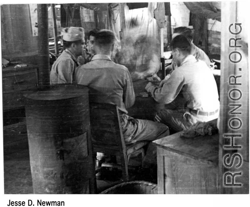 GIs play a card game in the barracks in the CBI during WWII.  Photo from Jesse D. Newman.