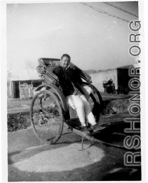 A rickshaw puller in China resting. During WWII.