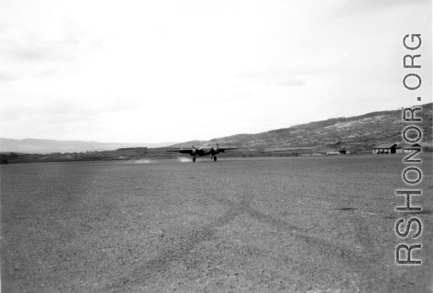 B-25 tail number 435, of the Ringer Squadron, above a runway in Yunnan.  From the collection of Wozniak, combat photographer for the 491st Bomb Squadron, in the CBI.