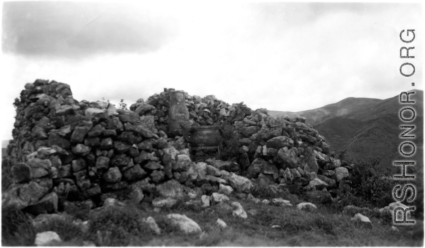 A small altar and figure in Yunnan province, China, during WWII.