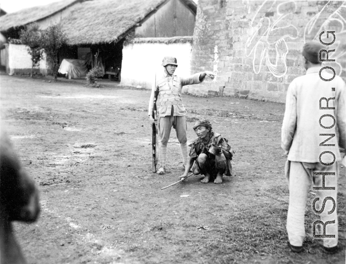 A beggar and a soldier, China, during WWII.  From the collection of Wozniak, combat photographer for the 491st Bomb Squadron, in the CBI.