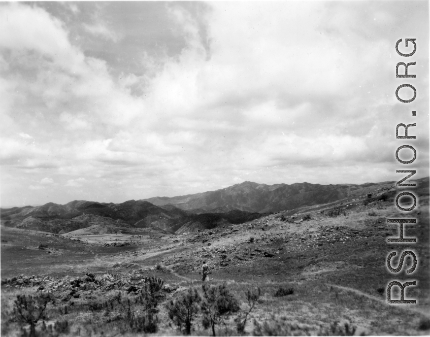 An American GI walks in the countryside in Yunnan province, China. During WWII.