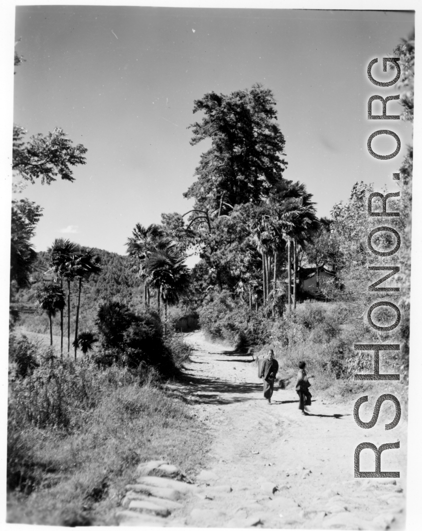 Local people walking in Yunnan province, China.  From the collection of Eugene T. Wozniak.