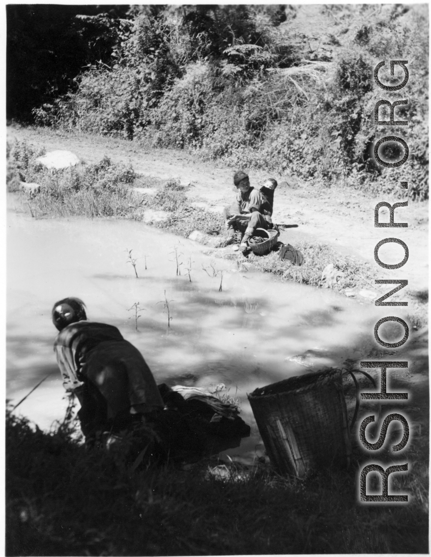 Local woman in Yunnan province, China, doing washing in a pond.  From the collection of Eugene T. Wozniak.