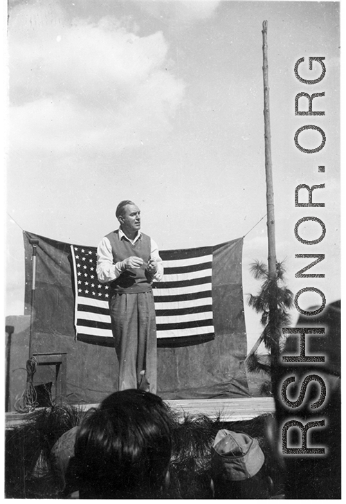Pat O'Brien's USO troupe performs at an American airbase in China in October 1944--Here  Pat O'Brien perform at the microphone.