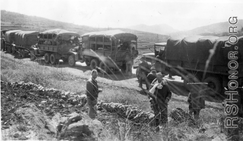 "Heading For Our new Home --After Flying The Hump Into Kunming We Moved By Truck Convoy To Our New Home In Kwelin. This Is A Photo Of The Convoy Stopped For A Break Along The Way. For The Final Leg Of This Trip We Loaded Everything On Flat Cars And Finished The Trip To Kwelin By Rail. " Caption courtesy of Elmer Bukey.