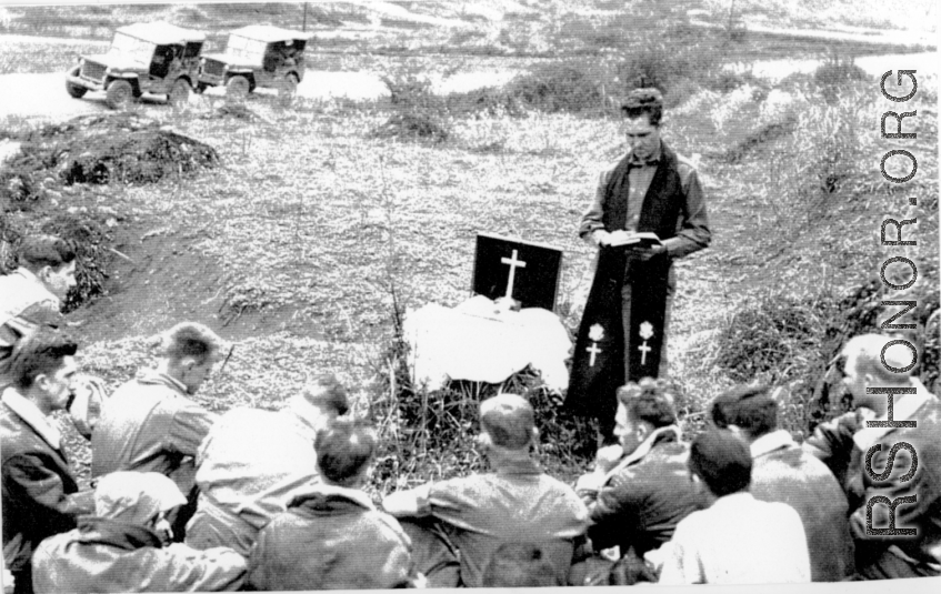 Retreat during Ichigo: "This is Captain Kelley our group chaplain holding roadside services for a group of G.I.'s during the evacuation of our base at Kwelin (Guilin) China."