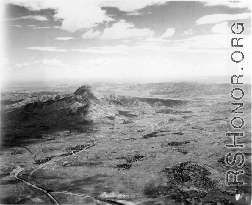 Plain and Yaolingshan (药灵山) mountain in Songming county, Yunnan province, China. During WWII.