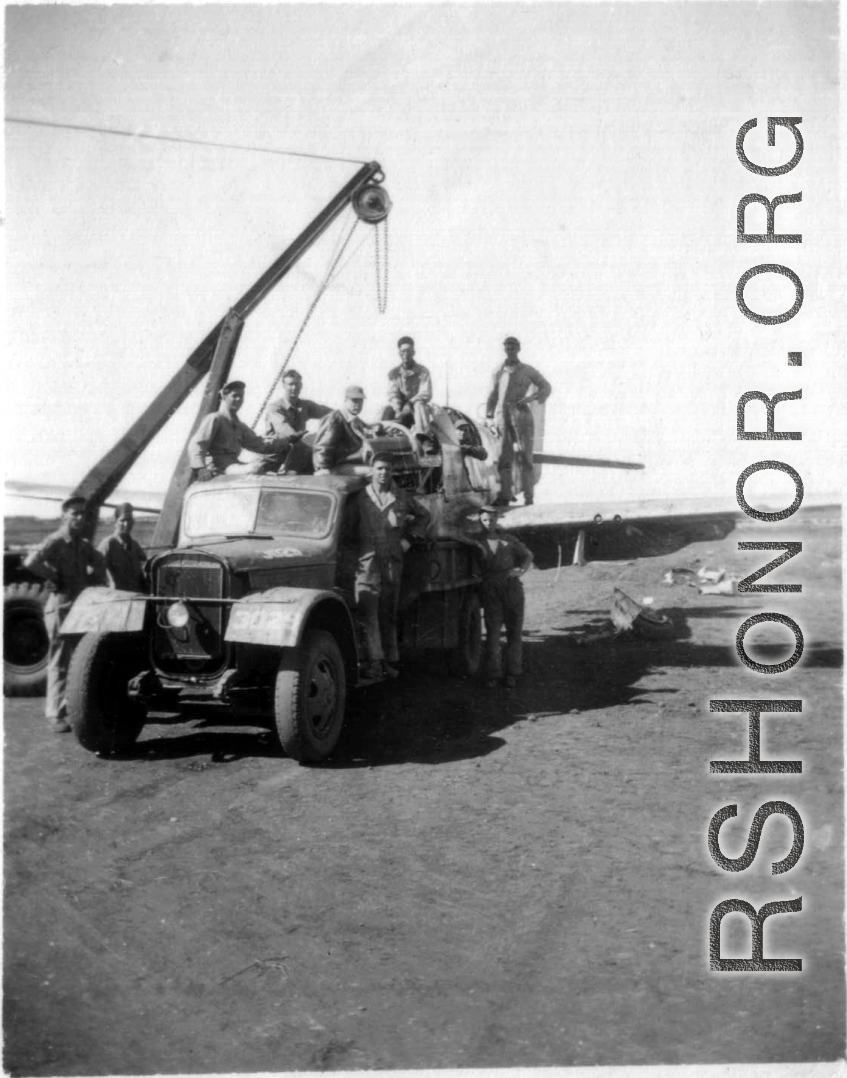 12th Air Service Group mechanics salvage a P-51 fighter in China during WWII.