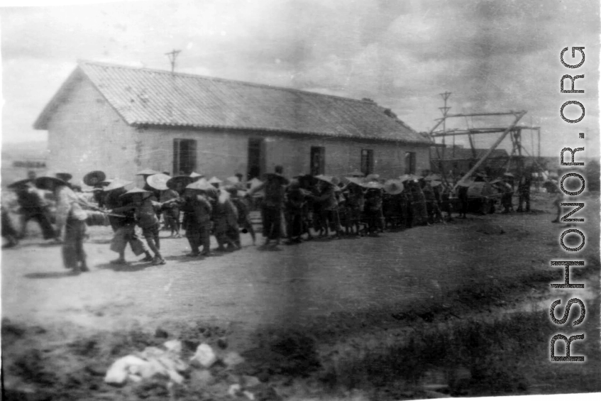 Chinese laborers pull a heavy concrete roller at an American base in China during WWII: "All the runways in China were made of crushed stone. They started the base with the larger stone and each layer that was added was of a smaller stone. The final layer of the runway surface was was made of finely crushed stone that was rolled and rerolled by Chinese coolies pulling a huge stone roller as shown in this picture. One of the big problems with our runways was the larger stone kept working their way to the sur