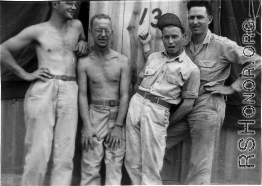 Men of the 12th Air Service Group in China goof for the camera: Left to right, Brantl, Wolfe, ? , ?