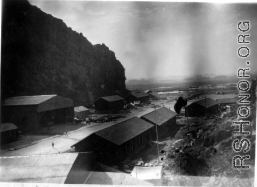 "Our First Home In China--This is a picture of our engineering area at Kwelin [Guilin],China. This was our first stop after leaving Kunming in January 1944. We had crews on detached service on bases at Hengyang, Chickiang, Chanyi, Ankang, Luichow, Nanning and Tanchuck. We were proud of the work performed at Kwelin. We built eight P-40's from the scrap-yard and turned them over to the line outfits to be returned to action." Caption courtesy of Elmer Bukey.