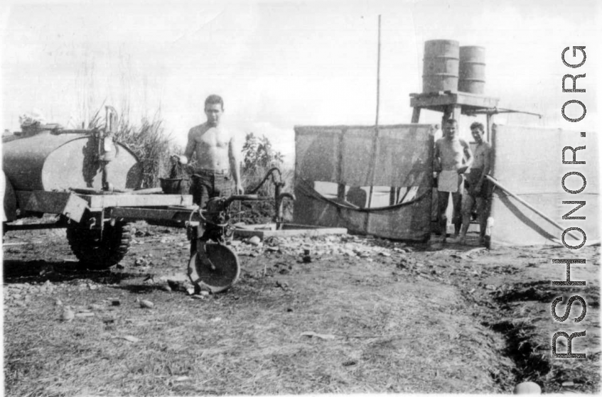 GIs bathing at Liuzhou from 55-gallon drums. During WWII.