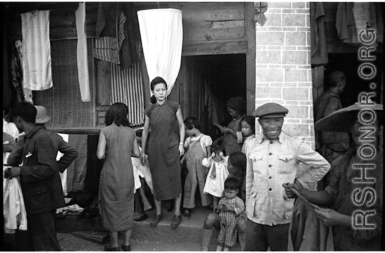 A Chinese women in the midst of daily life during war-time, in Yunnan province, China, most likely around the Luliang air base area.