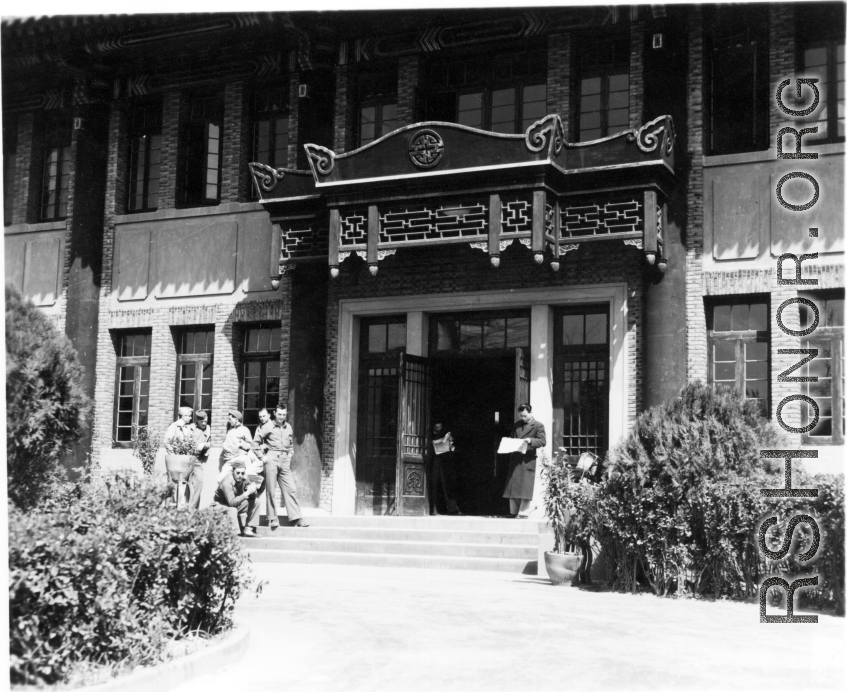 American GIs loiter outside an official looking building in China during WWII.