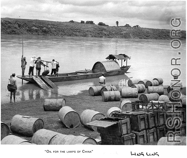 Shipping bombs and fuel by boat and hard human labor, near Lingling. During WWII.  From the collection of Hal Geer.