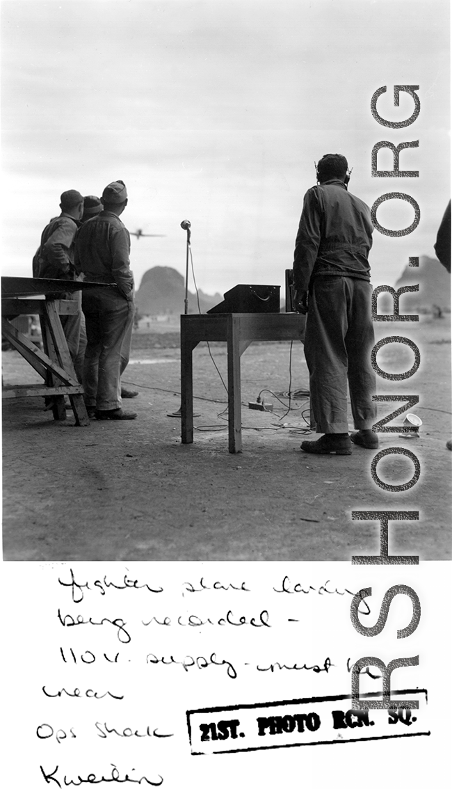 A film crew records the landing of an American fighter plane at Guilin during WWII.