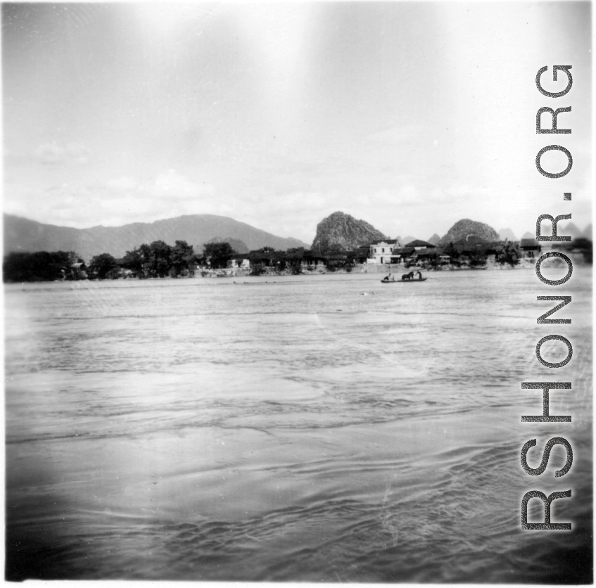 A river crossing, probably near Liuzhou (Liuchow) city, Guangxi province, China, during WWII.  Note the horse or mule riding the small boat.  Selig Seidler was a member of the 16th Combat Camera Unit in the CBI during WWII.