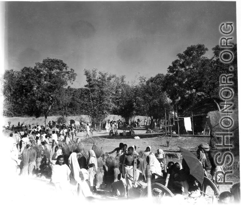 Local people at an open-air market in India during WWII.