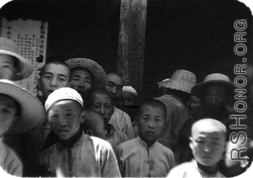 People in northern China pose at a transport company facility in northern China during WWII.