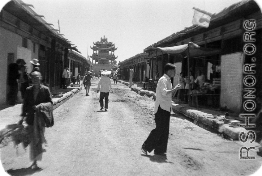 A drum or bell tower at the center crossroads of a squared, walled town in northern China, during WWII.