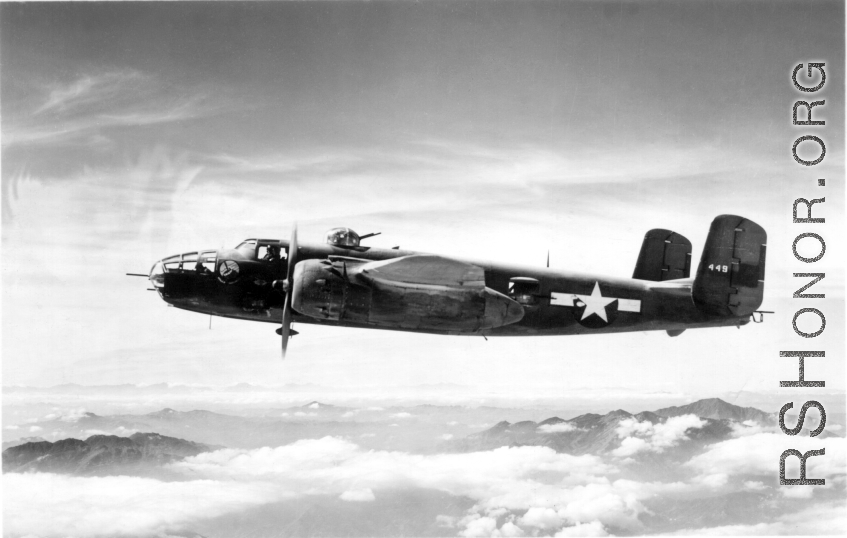 A B-25 bomber, tail #449, of the 491st Bombardment Squadron in flight on a mission.  From the collection of Frank Bates.