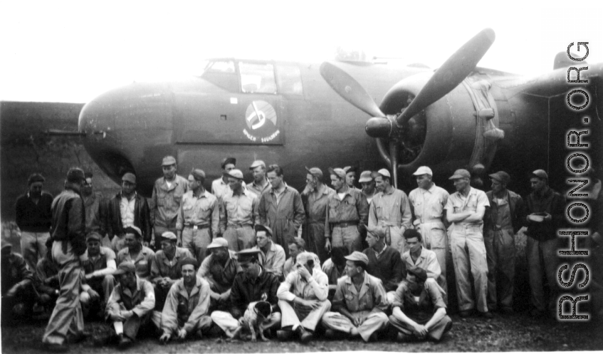 American flyers and mechanics, ground support, etc. gather for a group photo before a Ringer Squadron B-25 Mitchell. Yangkai, May or June 1944?