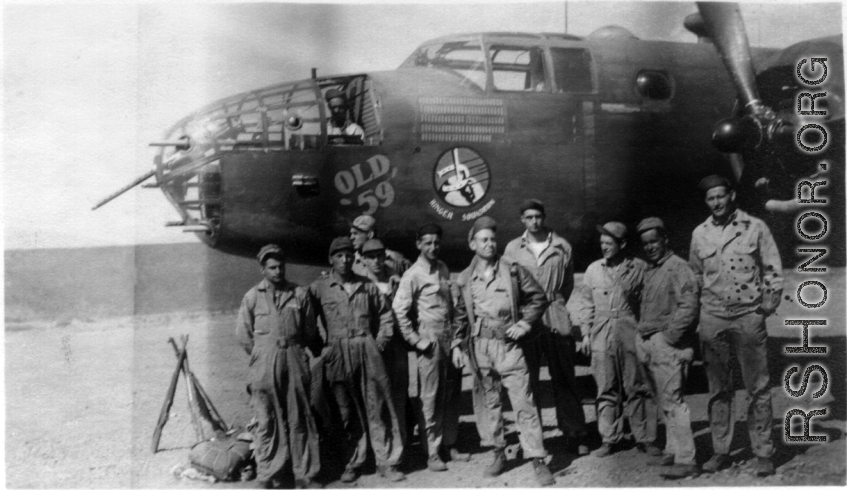 These 491st Bomb Squadron maintenance personnel pose for a photo after preparing "Old 59" for its triumphant return to the USA.  Wishing the plane a safe trip are Clayton E. "Fred" Nash, Wilbur Carter, Atkinson, Joseph A. Bicagalupo, Joseph F. Burns, Karl E. Hammett, center rear -- Frank Bates, William W. Byrant, Elmer M. Peterson, Arnold B. Christensen, Lloyd E. Kershaw . Yangkai, 1944.  (Info courtesy of Tony Strotman/Frank Willard Bates) 