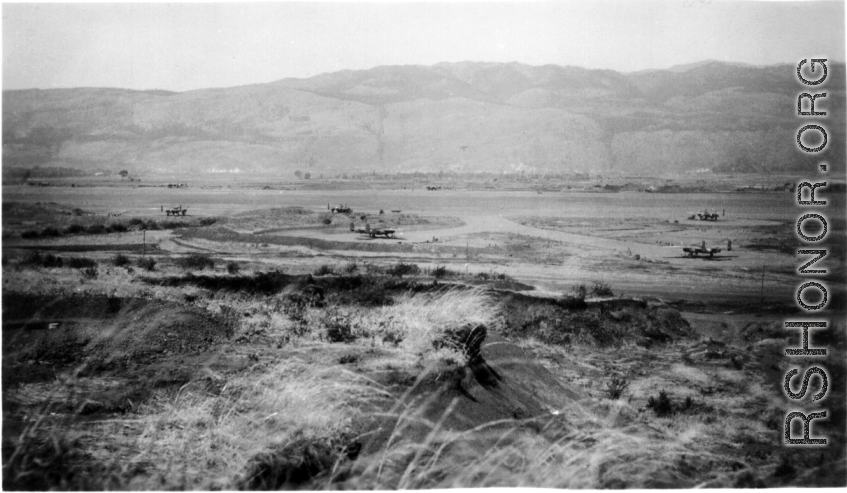 Overview of the American airbase at Yangkai (Yangjie) during WWII. Frank Bates notes, "Looking west across the valley. The newest planes' tail numbers are 336 & 340 and piloted by Alexander & Brillhart. Yangkai Army Air Base, China, early 1944." The 22nd and 491st Bombardment Squadrons arrived in January 1944 and shared the base with the 373rd Bomb Squadron (B-24s) for a few months. In the fall of 1944, the Japanese army overran the Liuzhou and Guilin bases, the 11th Bomb Squadron joined its "sister" units 