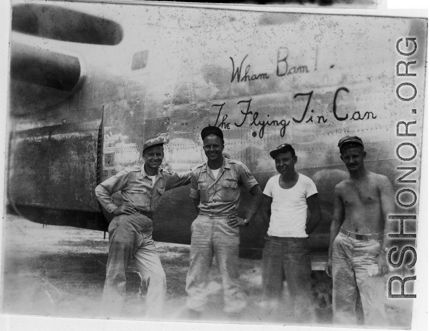 Some men stand before the B-24 "Wham Bam! The Flying Tin Can" in the CBI, which was the aircraft David Firman flew into China, on, flying into Hsinching.