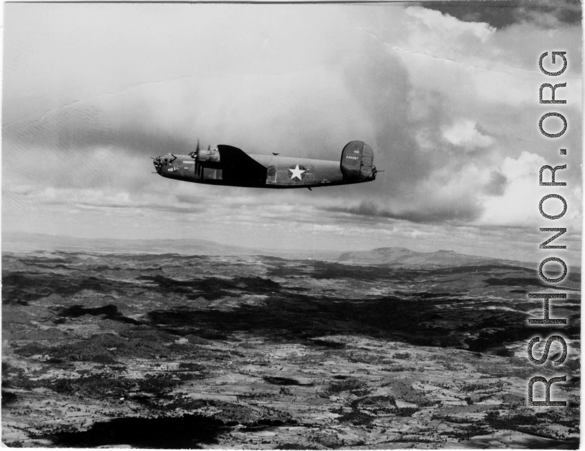 B-24 China Beauty (中国美人), tail #240367, in flight in the CBI.