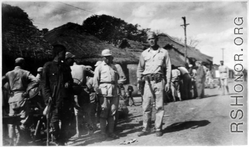 GI Joe and Chinese soldiers on a village street, probably outside of Yangkai base, Yunnan.