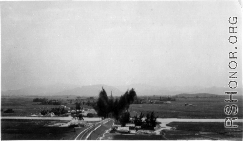 An aerial photograph of a bridge being bombed by the 491st Bomb Squadron in Yunnan or Indochina, during WWII.