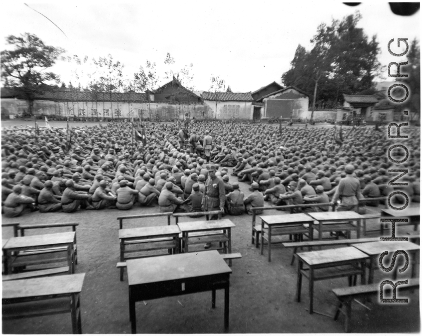 Chinese soldiers sitting during rally in southern China.